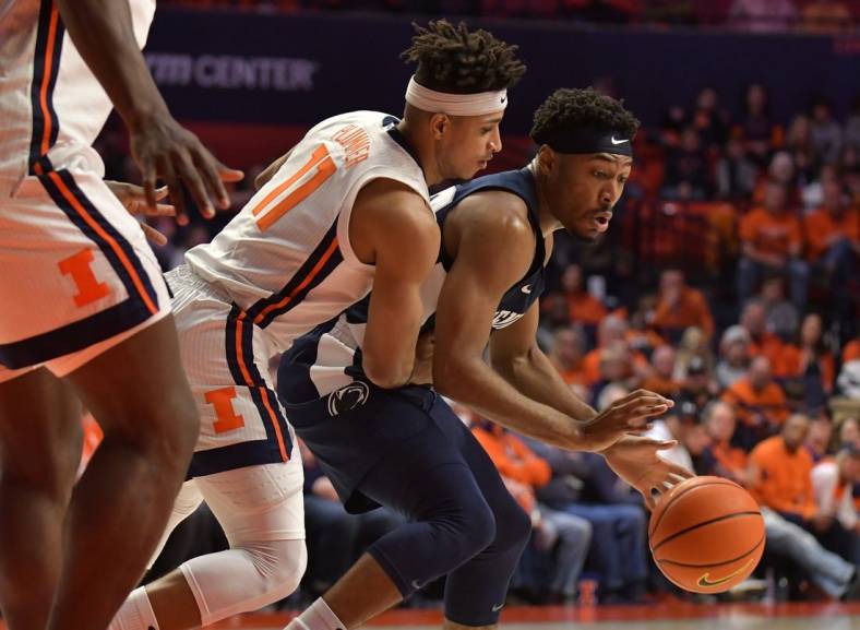 Mar 3, 2022; Champaign, Illinois, USA; Penn State Nittany Lions guard Jalen Pickett (22) dribbles the ball past Illinois Fighting Illini guard Alfonso Plummer (11) during the second half at State Farm Center. Mandatory Credit: Ron Johnson-USA TODAY Sports