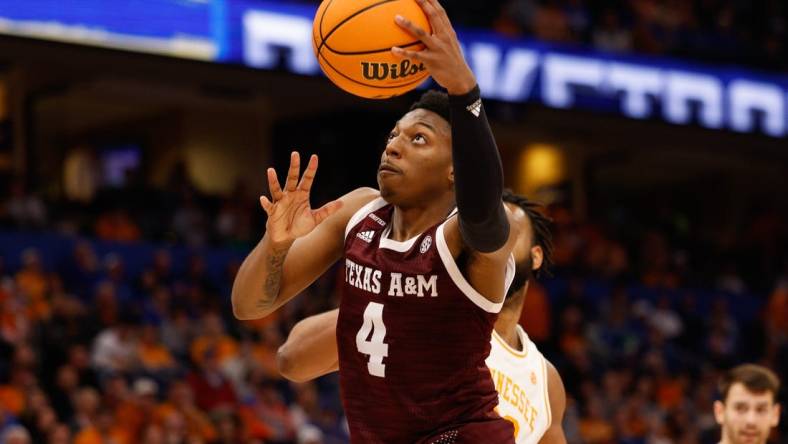 Mar 13, 2022; Tampa, FL, USA; Texas A&M Aggies guard Wade Taylor IV (4) drives to the basket against the Tennessee Volunteers in the second half at Amelie Arena. Mandatory Credit: Nathan Ray Seebeck-USA TODAY Sports