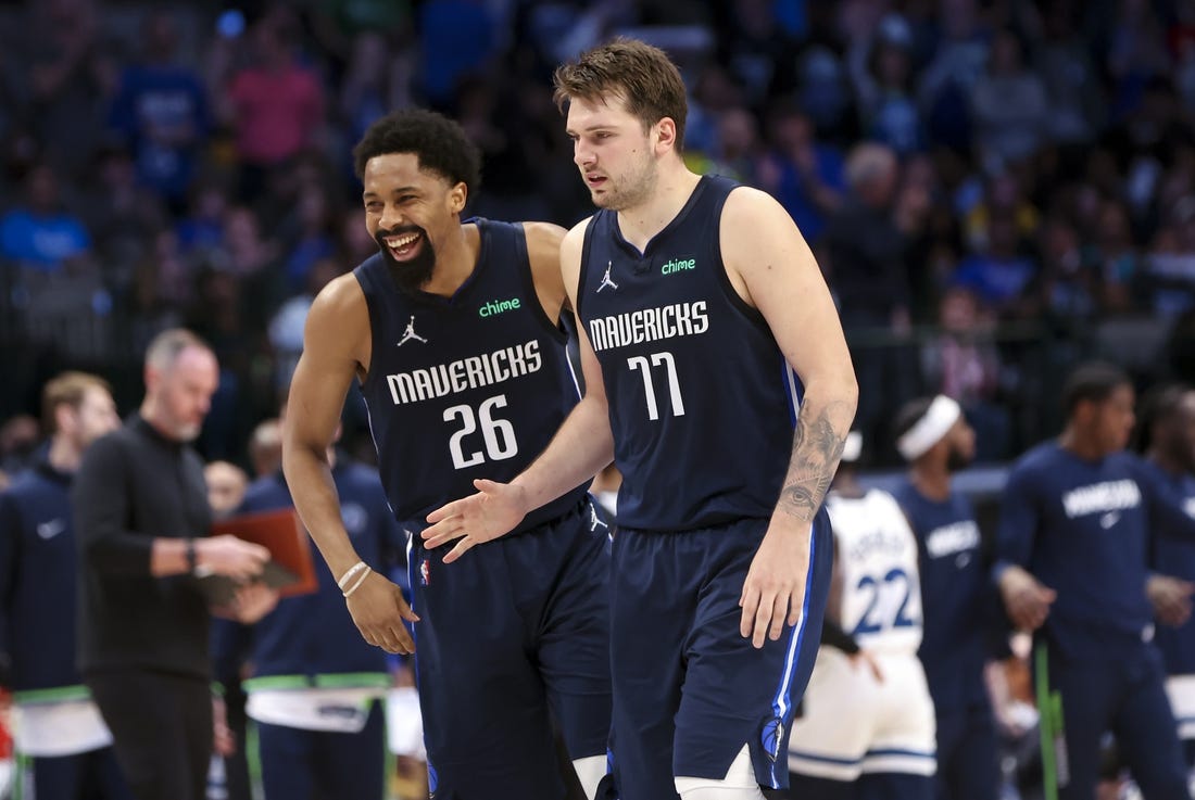 Mar 21, 2022; Dallas, Texas, USA;  Dallas Mavericks guard Luka Doncic (77) celebrates with Dallas Mavericks guard Spencer Dinwiddie (26) during the fourth quarter against the Minnesota Timberwolves at American Airlines Center. Mandatory Credit: Kevin Jairaj-USA TODAY Sports
