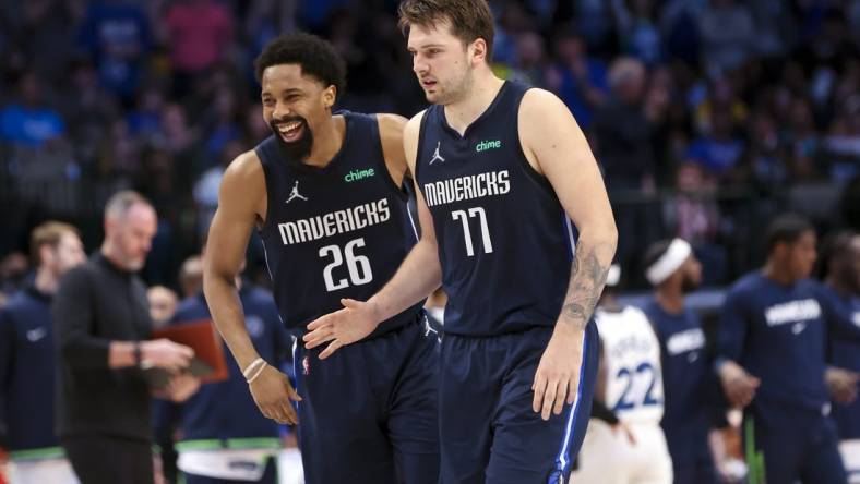 Mar 21, 2022; Dallas, Texas, USA;  Dallas Mavericks guard Luka Doncic (77) celebrates with Dallas Mavericks guard Spencer Dinwiddie (26) during the fourth quarter against the Minnesota Timberwolves at American Airlines Center. Mandatory Credit: Kevin Jairaj-USA TODAY Sports