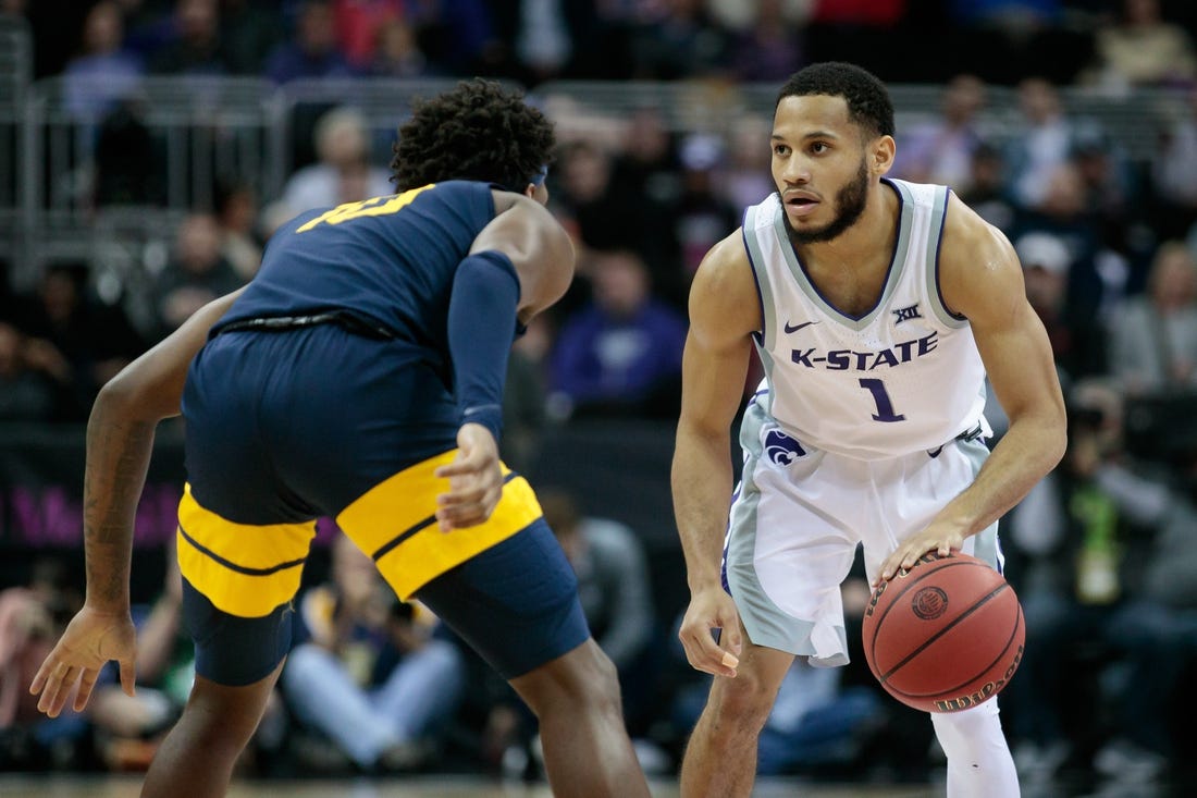 Mar 9, 2022; Kansas City, MO, USA;  Kansas State Wildcats guard Markquis Nowell (1) sets the play against the West Virginia Mountaineers at T-Mobile Center. Mandatory Credit: William Purnell-USA TODAY Sports