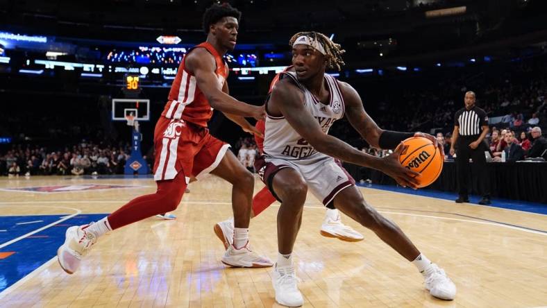 Mar 29, 2022; New York, New York, USA; Texas A&M Aggies guard Manny Obaseki (35) looks to make a move against Washington State Cougars guard TJ Bamba (5) during the second half of the NIT college basketball semifinals at Madison Square Garden. Mandatory Credit: Gregory Fisher-USA TODAY Sports