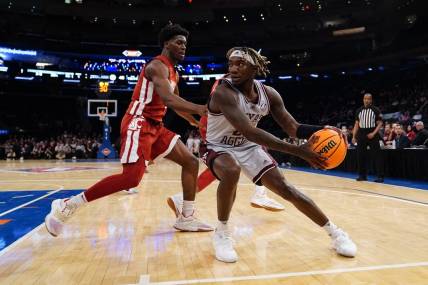 Mar 29, 2022; New York, New York, USA; Texas A&M Aggies guard Manny Obaseki (35) looks to make a move against Washington State Cougars guard TJ Bamba (5) during the second half of the NIT college basketball semifinals at Madison Square Garden. Mandatory Credit: Gregory Fisher-USA TODAY Sports