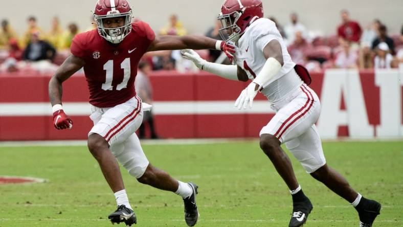 Apr 16, 2022; Tuscaloosa, Alabama, USA;  Crimson wide receiver Traeshon Holden (11) is defended by White defensive back Kool-Aid McKinstry (1) during the A-Day game at Bryant-Denny Stadium. Mandatory Credit: Gary Cosby Jr.-USA TODAY Sports