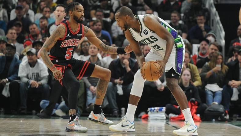 Apr 20, 2022; Milwaukee, Wisconsin, USA; Chicago Bulls forward Derrick Jones Jr. (5) defends Milwaukee Bucks forward Khris Middleton (22) in the first half during game two of the first round for the 2022 NBA playoffs at Fiserv Forum. Mandatory Credit: Michael McLoone-USA TODAY Sports