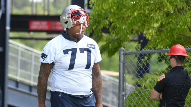 May 23, 2022; Foxborough, MA, USA; New England Patriots offensive tackle Trent Brown (77) walks to the practice field for the team's OTA at Gillette Stadium. Mandatory Credit: Eric Canha-USA TODAY Sports