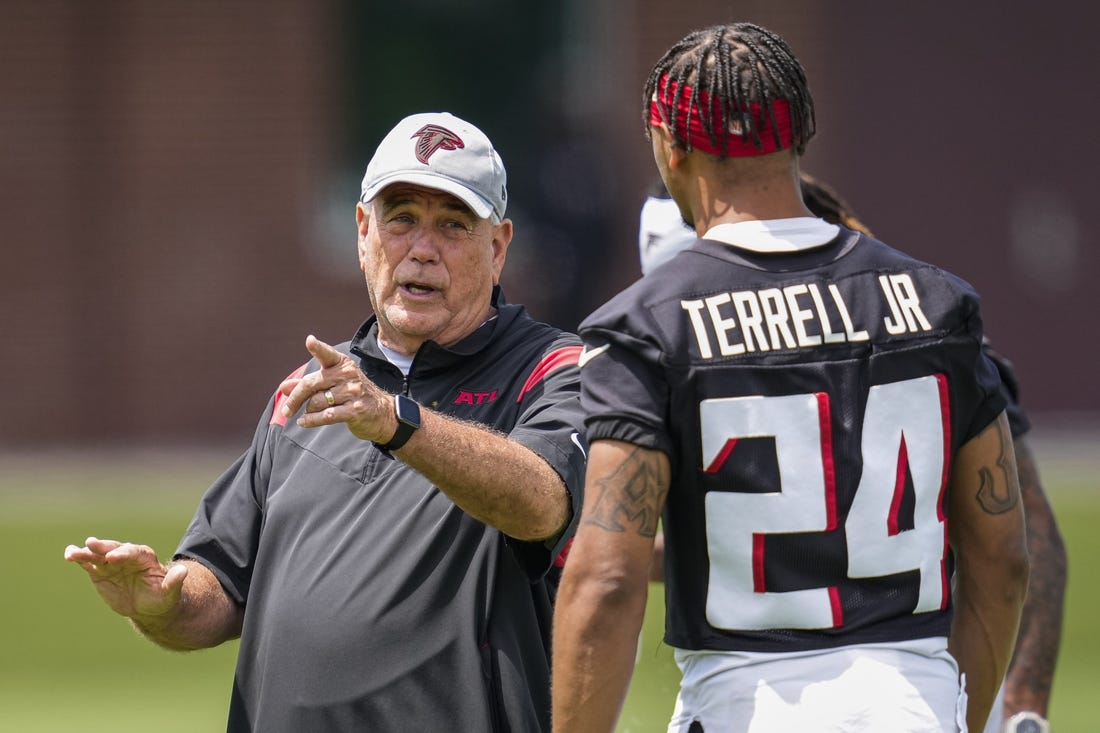 Jun 9, 2022; Atlanta, Georgia, USA; Atlanta Falcons defensive coordinator Dean Pees talks to cornerback A J Terrell (24) during OTA at Falcons Training Complex. Mandatory Credit: Dale Zanine-USA TODAY Sports