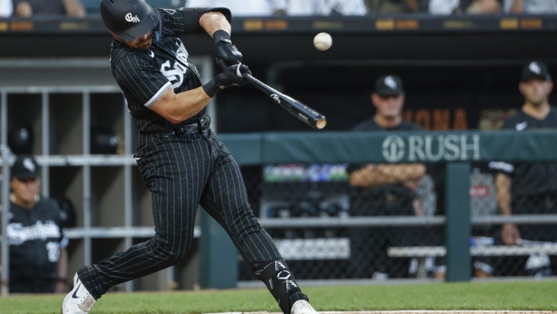 Jun 21, 2022; Chicago, Illinois, USA; Chicago White Sox second baseman Danny Mendick (20) singles against the Toronto Blue Jays during the third inning at Guaranteed Rate Field. Mandatory Credit: Kamil Krzaczynski-USA TODAY Sports