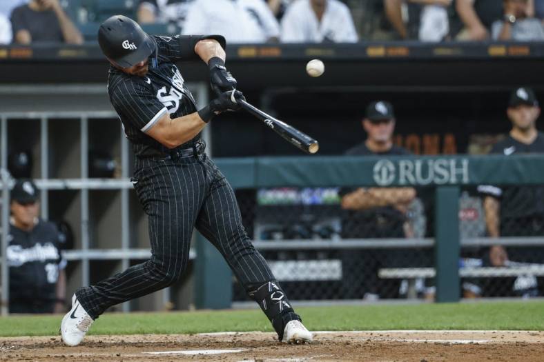 Jun 21, 2022; Chicago, Illinois, USA; Chicago White Sox second baseman Danny Mendick (20) singles against the Toronto Blue Jays during the third inning at Guaranteed Rate Field. Mandatory Credit: Kamil Krzaczynski-USA TODAY Sports