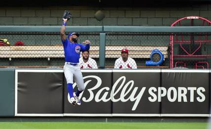 Jun 24, 2022; St. Louis, Missouri, USA;  Chicago Cubs right fielder Jason Heyward (22) leaps and catches a fly ball against the St. Louis Cardinals during the second inning at Busch Stadium. Mandatory Credit: Jeff Curry-USA TODAY Sports