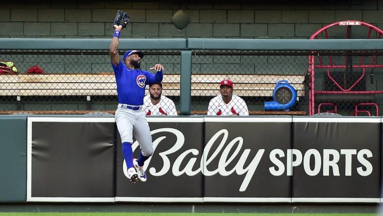 Jun 24, 2022; St. Louis, Missouri, USA;  Chicago Cubs right fielder Jason Heyward (22) leaps and catches a fly ball against the St. Louis Cardinals during the second inning at Busch Stadium. Mandatory Credit: Jeff Curry-USA TODAY Sports