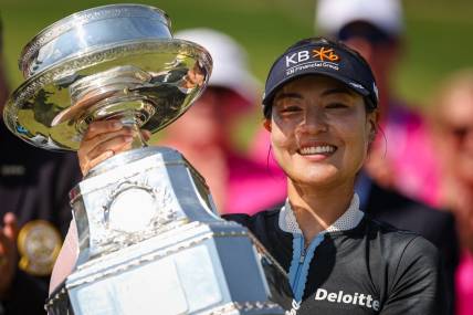 Jun 26, 2022; Bethesda, Maryland, USA; In Gee Chun holds the trophy after wining the KPMG Women's PGA Championship golf tournament at Congressional Country Club. Mandatory Credit: Scott Taetsch-USA TODAY Sports