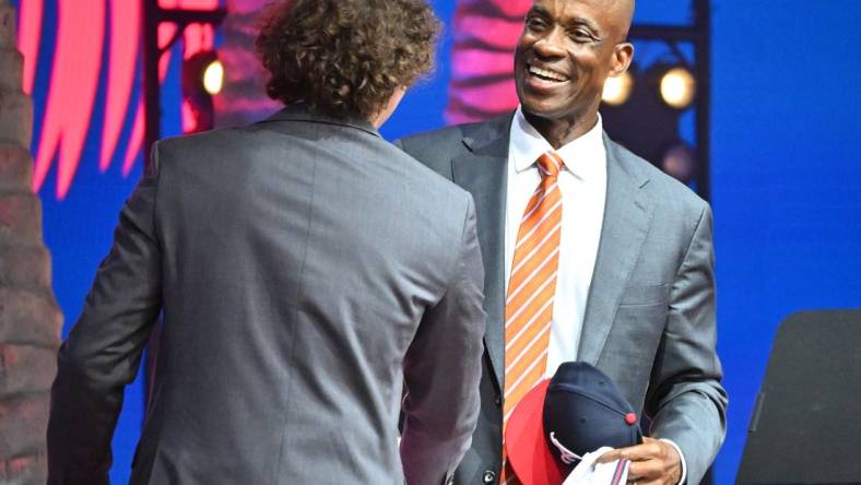 Jul 17, 2022; Los Angeles, CA, USA;  Former Atlanta Braves player Fred McGriff presents JR Ritchie with his jersey after he was selected by the Atlanta Braves as the 35th pick of the MLB draft at XBox Plaza at LA Live. Mandatory Credit: Jayne Kamin-Oncea-USA TODAY Sports