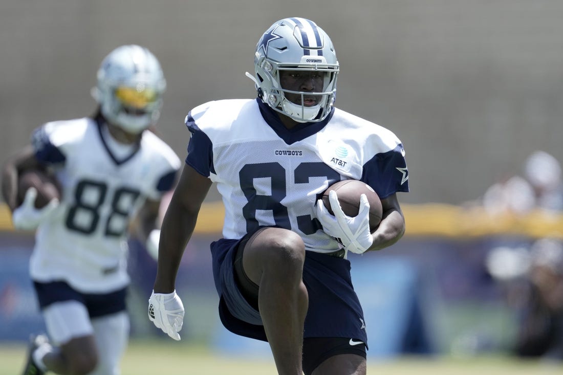 Jul 27, 2022; Oxnard, CA, USA; Dallas Cowboys receiver James Washington (83) carries the ball during training camp at the River Ridge Fields. Mandatory Credit: Kirby Lee-USA TODAY Sports