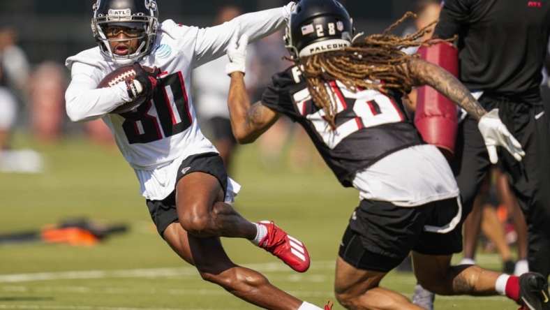 Jul 29, 2022; Flowery Branch, GA, USA; Atlanta Falcons wide receiver Cameron Batson (80) runs against defensive back Mike Ford (28) during training camp at IBM Performance Field. Mandatory Credit: Dale Zanine-USA TODAY Sports