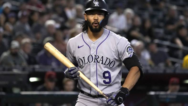 Aug 7, 2022; Phoenix, Arizona, USA; Colorado Rockies left fielder Connor Joe (9) reacts after striking out against the Arizona Diamondbacks in the sixth inning at Chase Field. Mandatory Credit: Rick Scuteri-USA TODAY Sports