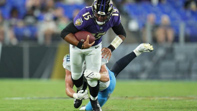 Aug 11, 2022; Baltimore, Maryland, USA;  Tennessee Titans linebacker Jack Gibbens (50) tackles Baltimore Ravens quarterback Brett Hundley (15) during the third quarter of a preseason game at M&T Bank Stadium. Mandatory Credit: Jessica Rapfogel-USA TODAY Sports