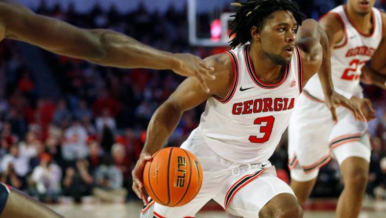 Feb. 5, 2022; Athens, Georgia, USA; Georgia Bulldogs guard Kario Oquendo (3) drives against the Auburn Tigers at Stegeman Coliseum. Joshua L. Jones/Athens Banner-Herald via USA TODAY NETWORK

Ncaa Basketball Auburn At Georgia