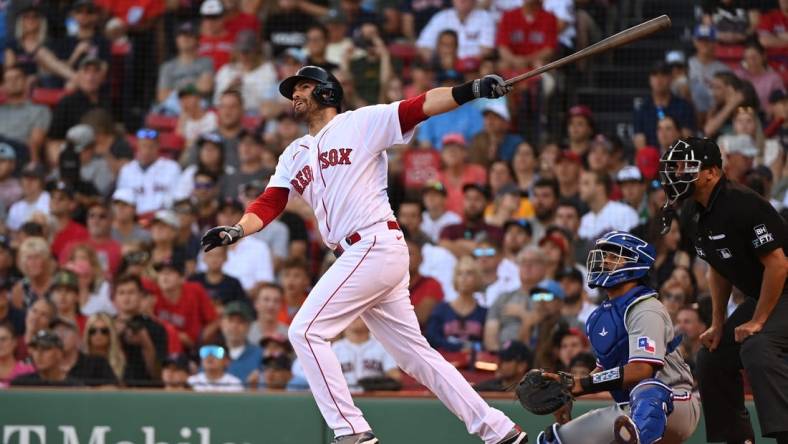 Sep 3, 2022; Boston, Massachusetts, USA; Boston Red Sox designated hitter J.D. Martinez (28) hits an RBI double against the Texas Rangers at Fenway Park. Mandatory Credit: Eric Canha-USA TODAY Sports