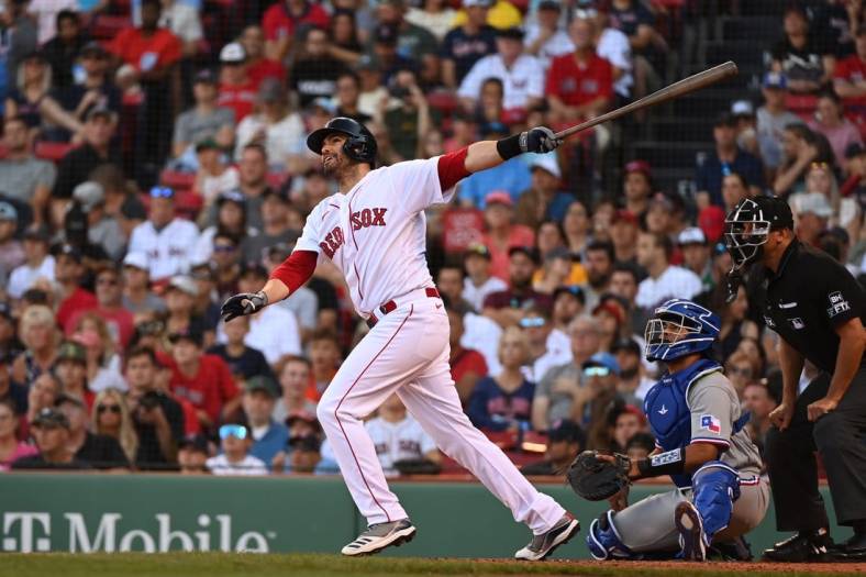 Sep 3, 2022; Boston, Massachusetts, USA; Boston Red Sox designated hitter J.D. Martinez (28) hits an RBI double against the Texas Rangers at Fenway Park. Mandatory Credit: Eric Canha-USA TODAY Sports