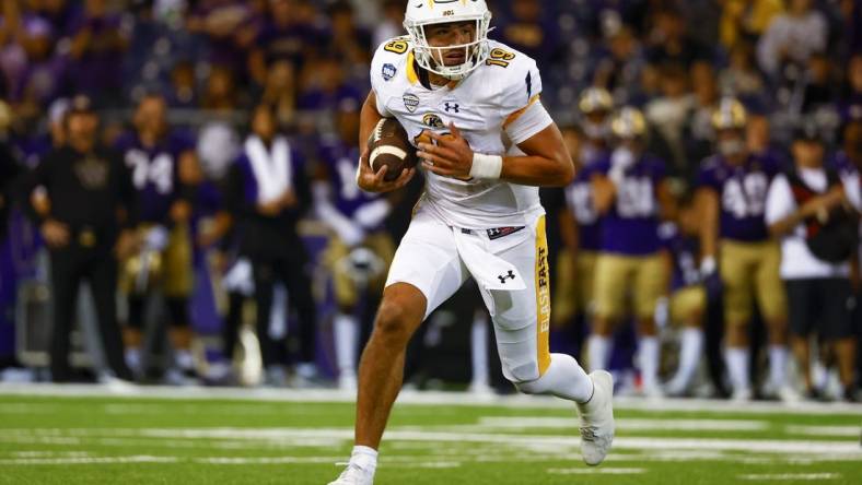 Sep 3, 2022; Seattle, Washington, USA; Kent State Golden Flashes quarterback Collin Schlee (19) rushes against the Washington Huskies during the second quarter at Alaska Airlines Field at Husky Stadium. Mandatory Credit: Joe Nicholson-USA TODAY Sports