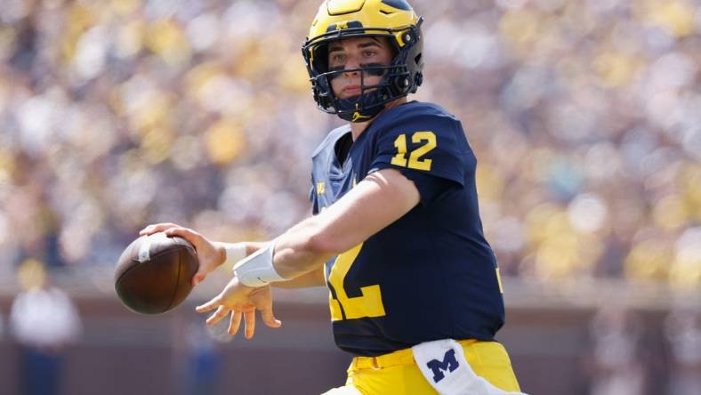 Sep 3, 2022; Ann Arbor, Michigan, USA;  Michigan Wolverines quarterback Cade McNamara (12) passes against the Colorado State Rams at Michigan Stadium. Mandatory Credit: Rick Osentoski-USA TODAY Sports