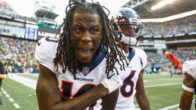 Sep 12, 2022; Seattle, Washington, USA; Denver Broncos wide receiver Jerry Jeudy (10) celebrates on the sideline after catching a touchdown pass against the Seattle Seahawks during the second quarter at Lumen Field. Mandatory Credit: Joe Nicholson-USA TODAY Sports