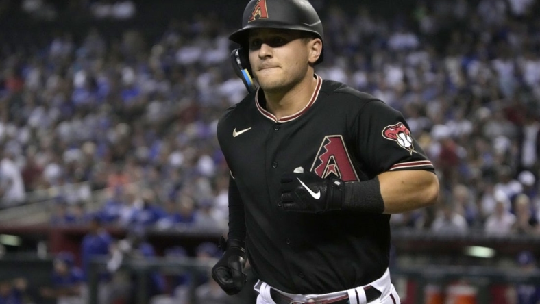 Sep 14, 2022; Phoenix, Arizona, USA; Arizona Diamondbacks right fielder Daulton Varsho (12) rounds the bases after hitting a solo home run against the Los Angeles Dodgers in the first inning at Chase Field. Mandatory Credit: Rick Scuteri-USA TODAY Sports