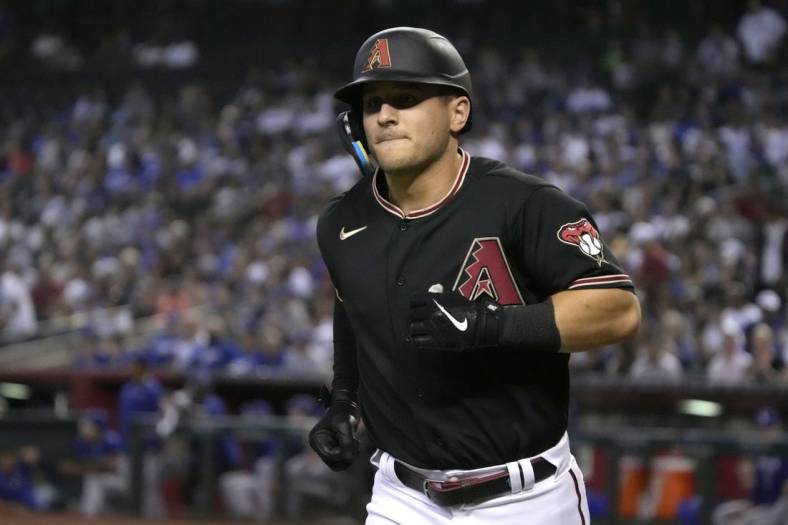 Sep 14, 2022; Phoenix, Arizona, USA; Arizona Diamondbacks right fielder Daulton Varsho (12) rounds the bases after hitting a solo home run against the Los Angeles Dodgers in the first inning at Chase Field. Mandatory Credit: Rick Scuteri-USA TODAY Sports