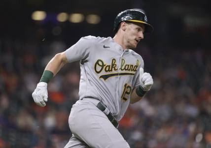 Sep 15, 2022; Houston, Texas, USA; Oakland Athletics catcher Sean Murphy (12) runs to first base on a double during the fourth inning against the Houston Astros at Minute Maid Park. Mandatory Credit: Troy Taormina-USA TODAY Sports