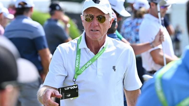 Sep 17, 2022; Chicago, Illinois, USA; Greg Norman greets people on the driving range before the second round of the Invitational Chicago LIV Golf tournament at Rich Harvest Farms. Mandatory Credit: Jamie Sabau-USA TODAY Sports