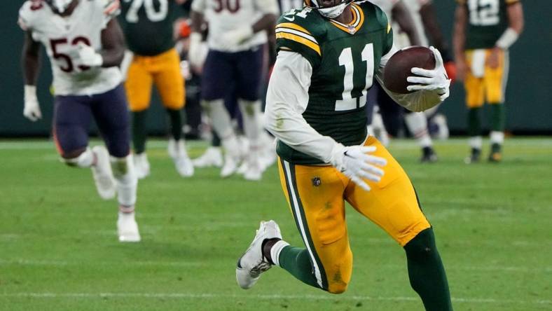 Sep 18, 2022; Green Bay, Wisconsin, USA; Green Bay Packers wide receiver Sammy Watkins (11) picks up 14 yards on a reception during the fourth quarter of their game at Lambeau Field. Mandatory Credit: Mark Hoffman/Milwaukee Journal Sentinel