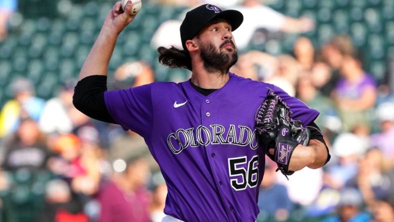 Sep 22, 2022; Denver, Colorado, USA; Colorado Rockies relief pitcher Chad Smith (56) pitches in the ninth inning against the San Francisco Giants at Coors Field. Mandatory Credit: Ron Chenoy-USA TODAY Sports