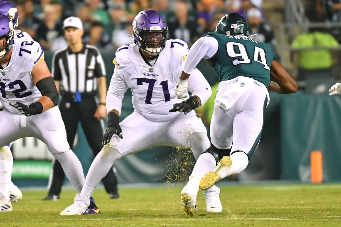 Sep 19, 2022; Philadelphia, Pennsylvania, USA;  Minnesota Vikings offensive tackle Christian Darrisaw (71) blocks Philadelphia Eagles defensive end Josh Sweat (94) at Lincoln Financial Field. Mandatory Credit: Eric Hartline-USA TODAY Sports