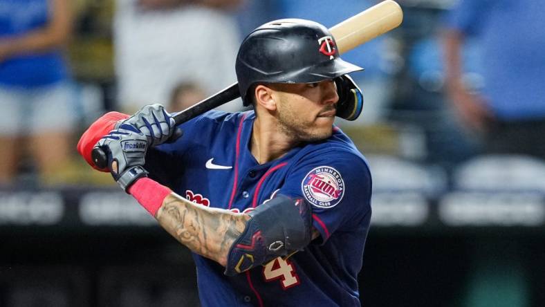 Sep 20, 2022; Kansas City, Missouri, USA; Minnesota Twins shortstop Carlos Correa (4) bats against the Kansas City Royals during the ninth inning at Kauffman Stadium. Mandatory Credit: Jay Biggerstaff-USA TODAY Sports