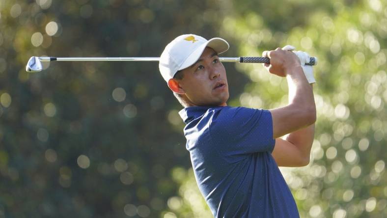 Sep 24, 2022; Charlotte, North Carolina, USA; Team USA golfer Collin Morikawa hits his tee shot on the sixth hole during the foursomes match play of the Presidents Cup golf tournament at Quail Hollow Club. Mandatory Credit: Peter Casey-USA TODAY Sports