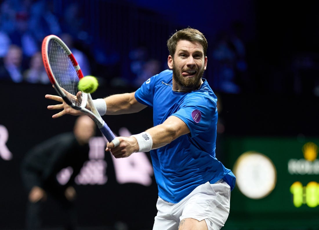 Sep 24, 2022; London, United Kingdom;
Cameron Norrie (GBR) plays a shot against Taylor Fritz (USA) in a Laver Cup singles match.  Mandatory Credit: Peter van den Berg-USA TODAY Sports