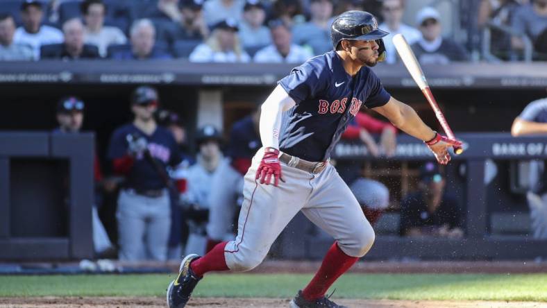 Sep 24, 2022; Bronx, New York, USA;  Boston Red Sox shortstop Xander Bogaerts (2) hits a single in the seventh inning against the New York Yankees at Yankee Stadium. Mandatory Credit: Wendell Cruz-USA TODAY Sports