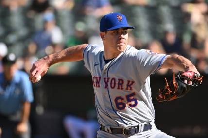 Sep 24, 2022; Oakland, California, USA; New York Mets relief pitcher Trevor May (65) throws a pitch against the Oakland Athletics during the eighth inning at RingCentral Coliseum. Mandatory Credit: Robert Edwards-USA TODAY Sports