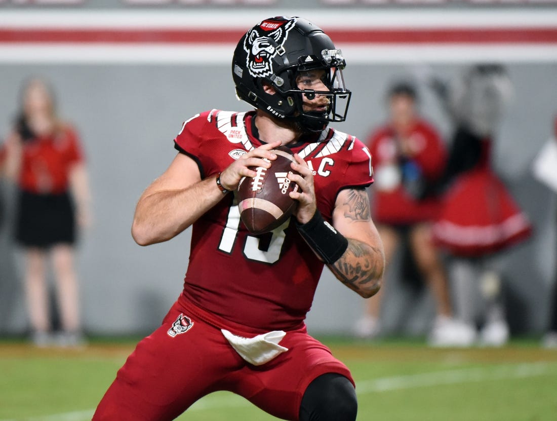 Sep 24, 2022; Raleigh, North Carolina, USA; North Carolina State Wolfpack quarterback Devin Leary (13) looks to throw during the first half against the Connecticut Huskies at Carter-Finley Stadium. Mandatory Credit: Rob Kinnan-USA TODAY Sports