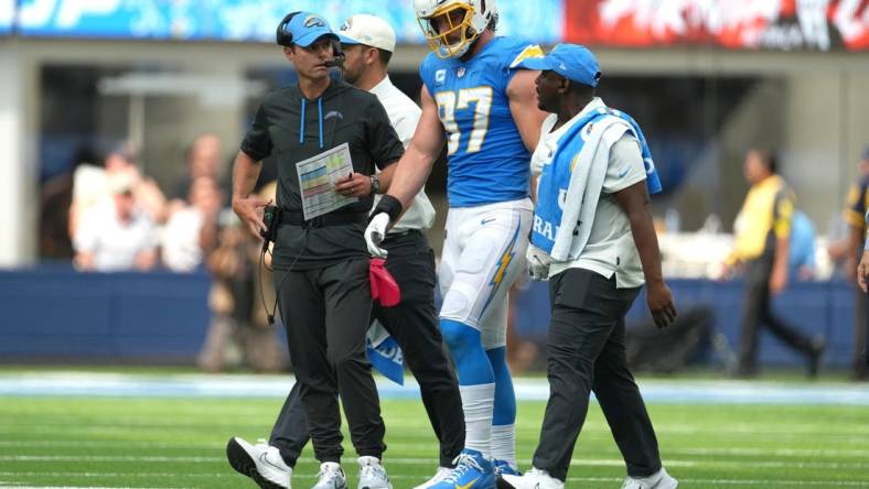 Sep 25, 2022; Inglewood, California, USA; Los Angeles Chargers linebacker Joey Bosa (97) walks off the field with Brandon Staley after suffering an injury against the Jacksonville Jaguars in the first half at SoFi Stadium. Mandatory Credit: Kirby Lee-USA TODAY Sports