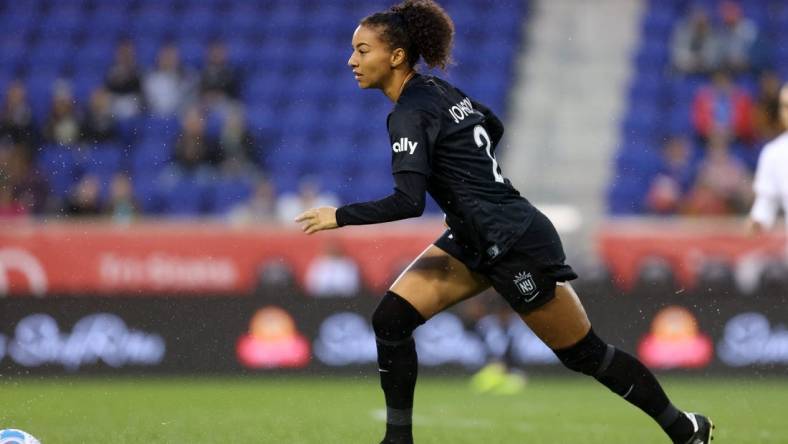 Oct 1, 2022; Harrison, New Jersey, USA; NJ/NY Gotham FC defender Estelle Johnson Mewis (24) kicks the ball against the Portland Thorns FC during the first half at Red Bull Arena. Mandatory Credit: Craig Mitchelldyer-USA TODAY Sports