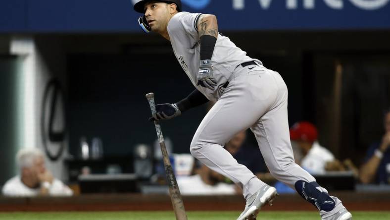 Oct 4, 2022; Arlington, Texas, USA; New York Yankees right fielder Marwin Gonzalez (14) singles in a run in the fifth inning against the Texas Rangers at Globe Life Field. Mandatory Credit: Tim Heitman-USA TODAY Sports