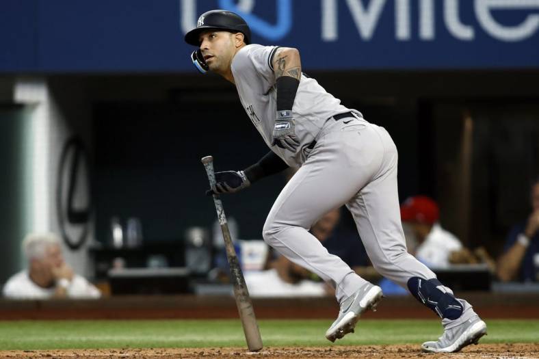 Oct 4, 2022; Arlington, Texas, USA; New York Yankees right fielder Marwin Gonzalez (14) singles in a run in the fifth inning against the Texas Rangers at Globe Life Field. Mandatory Credit: Tim Heitman-USA TODAY Sports