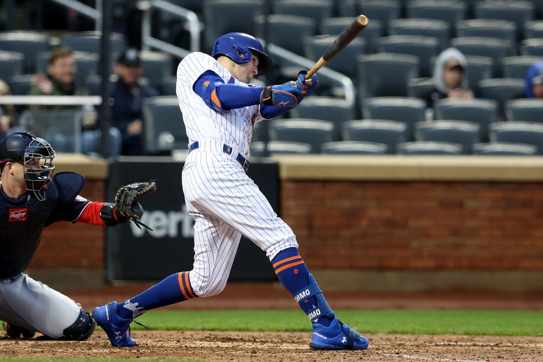 Oct 4, 2022; New York City, New York, USA; New York Mets center fielder Brandon Nimmo (9) follows through on a solo home run against the Washington Nationals during the fourth inning at Citi Field. Mandatory Credit: Brad Penner-USA TODAY Sports