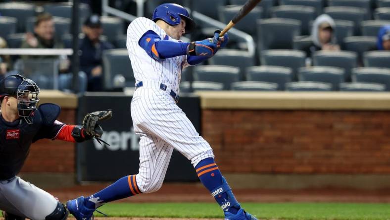 Oct 4, 2022; New York City, New York, USA; New York Mets center fielder Brandon Nimmo (9) follows through on a solo home run against the Washington Nationals during the fourth inning at Citi Field. Mandatory Credit: Brad Penner-USA TODAY Sports