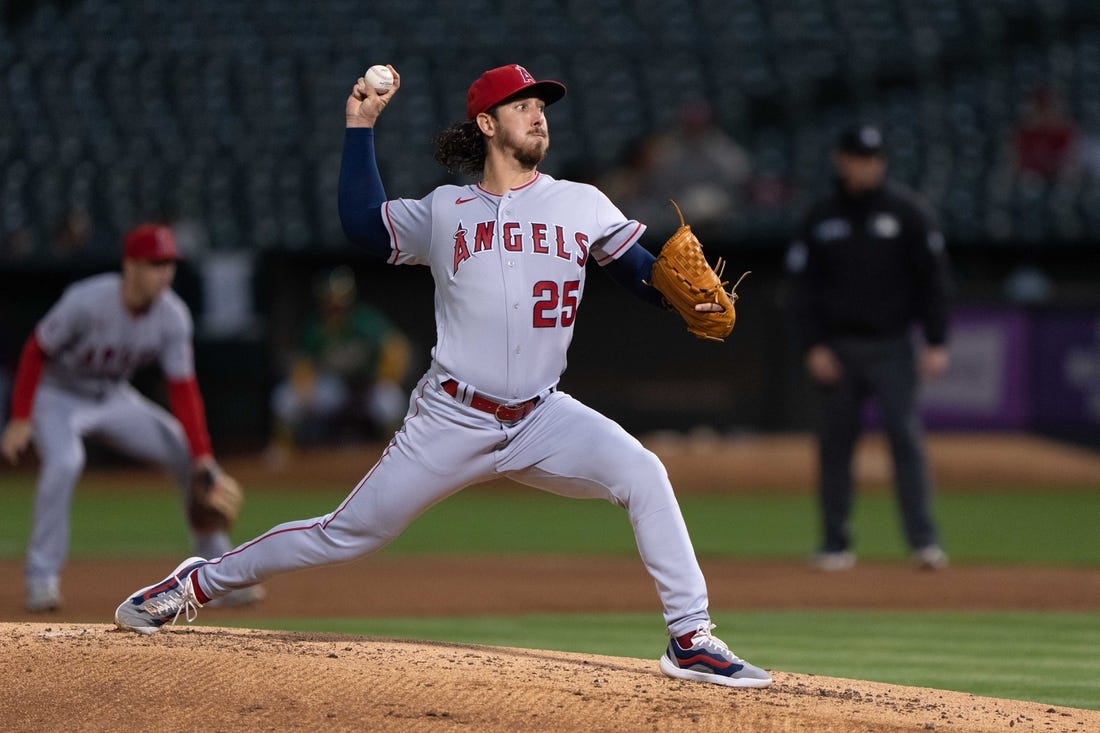 Oct 4, 2022; Oakland, California, USA;  Los Angeles Angels starting pitcher Michael Lorenzen (25) pitches during the first inning against the Oakland Athletics at RingCentral Coliseum. Mandatory Credit: Stan Szeto-USA TODAY Sports