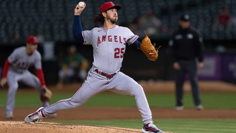 Oct 4, 2022; Oakland, California, USA;  Los Angeles Angels starting pitcher Michael Lorenzen (25) pitches during the first inning against the Oakland Athletics at RingCentral Coliseum. Mandatory Credit: Stan Szeto-USA TODAY Sports