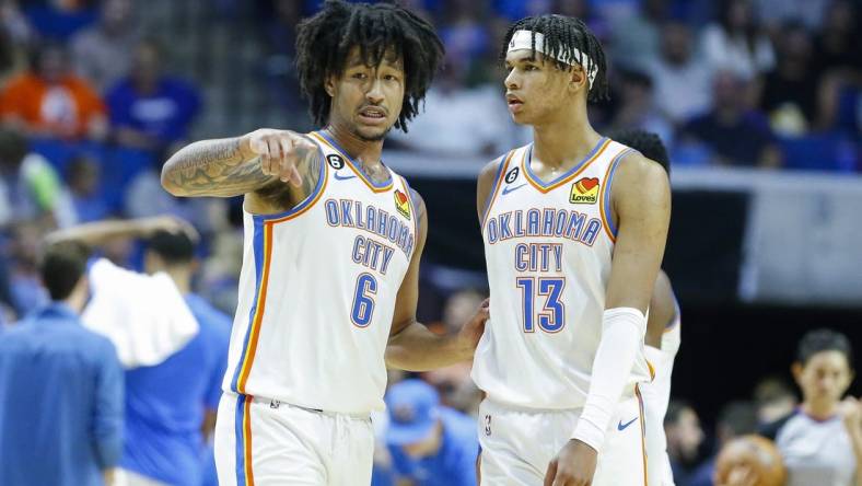 Oct 5, 2022; Tulsa, Oklahoma, USA; Oklahoma City Thunder forward Jaylin Williams (6) and forward Ousmane Dieng (13) talk during a time out against the Dallas Mavericks during the second half of a pre-season game at BOK Center. Dallas won 98-96. Mandatory Credit: Alonzo Adams-USA TODAY Sports