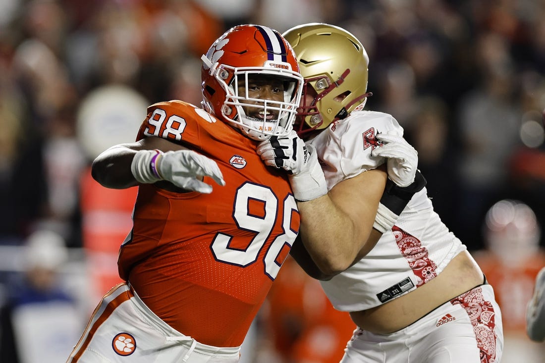 Oct 8, 2022; Chestnut Hill, Massachusetts, USA; Clemson Tigers defensive end Myles Murphy (98) fights to get past Boston College Eagles offensive lineman Ozzy Trapilo (70) during the second quarter at Alumni Stadium. Mandatory Credit: Winslow Townson-USA TODAY Sports